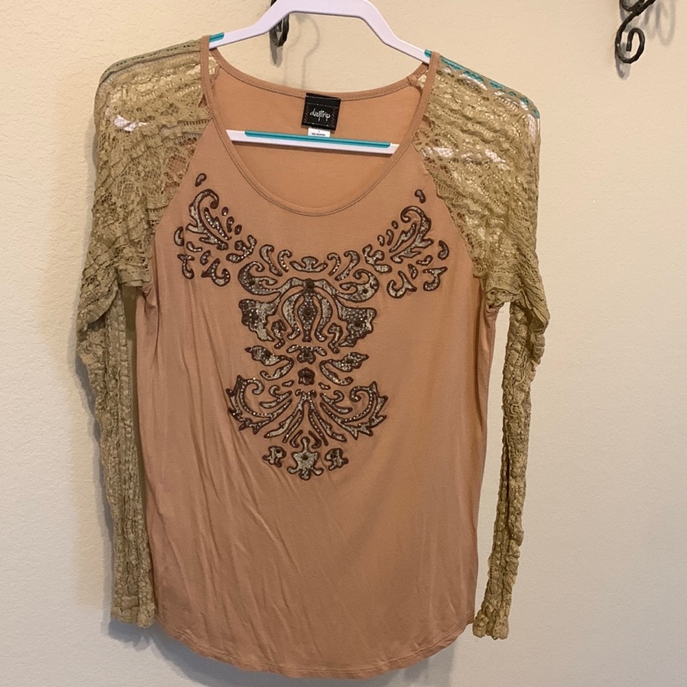 Ladies L/S mixed media tee with front sequin design and lace sleeves.